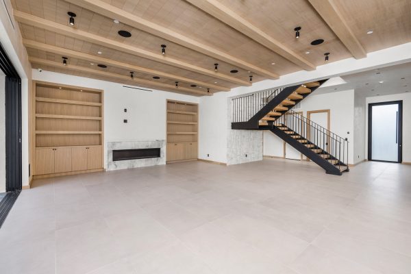 Cozy living room with elegant wooden staircase